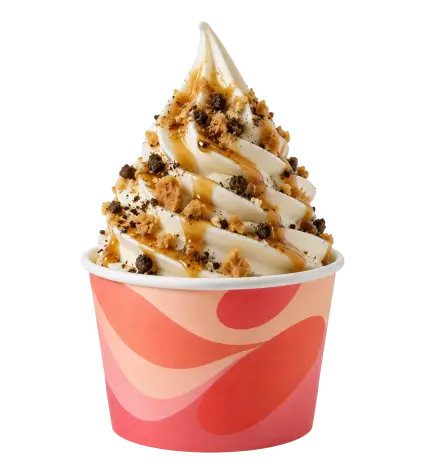 Vanilla soft serve ice cream with caramel sauce and cookie crumbs