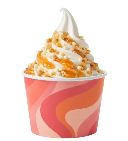 Frozen yogurt with mango sauce and crispy toppings