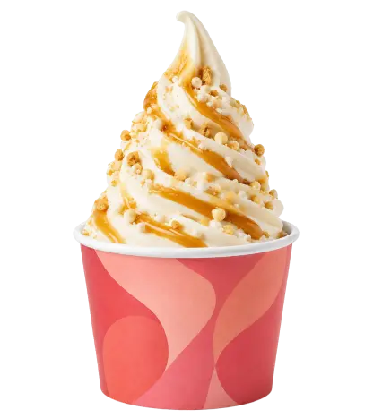 Frozen yogurt with caramel sauce and crispy toppings